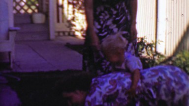 1957: Mom bucking bronco child riding hold on tight accident game.