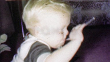 1957: Young growing caucasian boy eating ice cream from bowl.