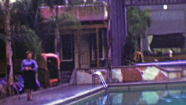 1958: Women inspecting hotel pool during daylight operating hours.