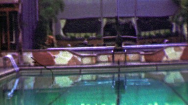 1958: Hotel resort pool lounge chair relaxation vacation fun zone.