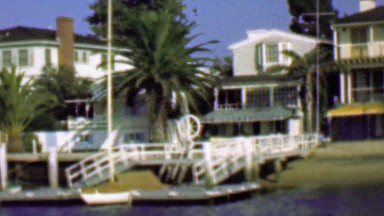 1958: Wealthy waterfront residential homes private docks boats.
