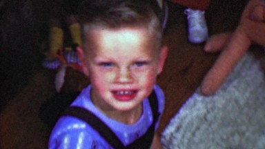 1958: Happy 1950s greaser style boy full of life and joy.