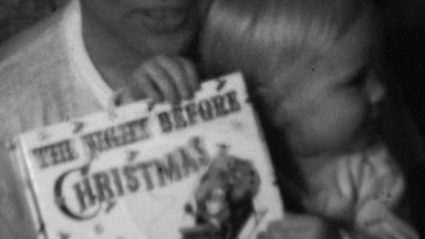 1958: Night Before Christmas bedtime story book reading.