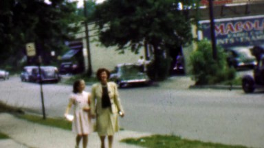 1961: Mother daughter sidewalk classic 1950s cars summer suburban.