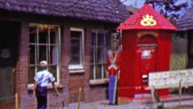1962: Kid walking through Solvang Danish Days cottage exhibit.