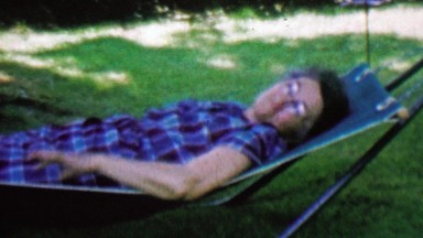 1962: Grandma resting outdoor summer shade hammock.