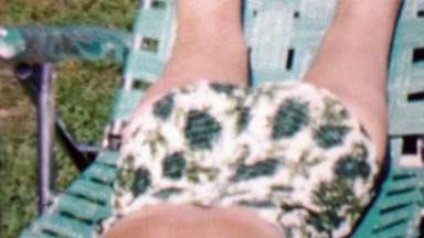 1962: Bathing suit closeup sunbathing women practices ass shake.