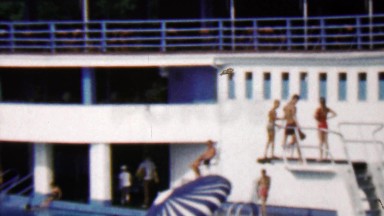 1962: Big outdoor public swimming pool compound perfect blue waters.