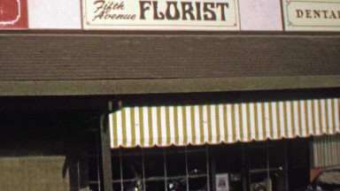 1974: Fifth Avenue Florists building front public facing open store.