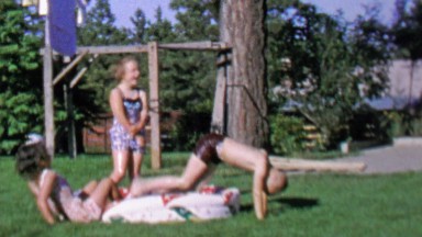 1967: Boy Splashes Kids in Backyard Pool with Friends and Siblings
