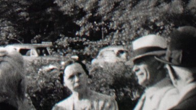 1939: Gangster men fedora hats visit innocent family midday sunshine.