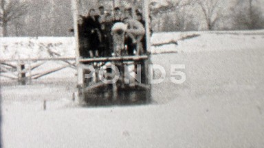 1939: Polar bear club jumping into frozen ice cold lake water.