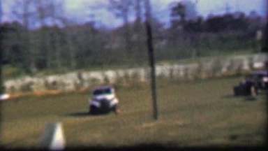 1957: Classic Car Racing Taking Unbanked Turns at High Speeds