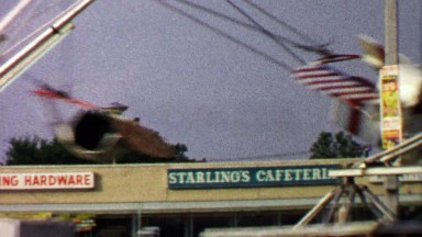 Amusement Park Ride in Shopping Strip Mall Parking Lot