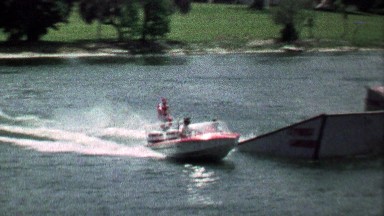 1967: Acrobatic stunt waterskier flips off ramp and safely lands.