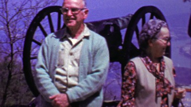 1964: Family enjoying view military cannon war memorial site.