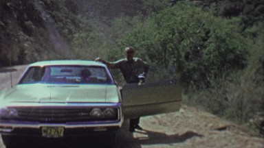 1961: Impatient dad family pulls over while family waits in car.