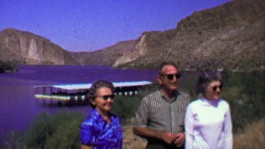 1961: Family lakeside docs enjoying summer sunshine wilderness.