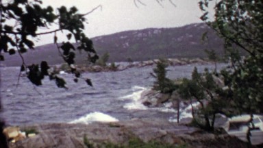 1957: Wind Storm Hits Rocky Lake Boat Tied to Dock