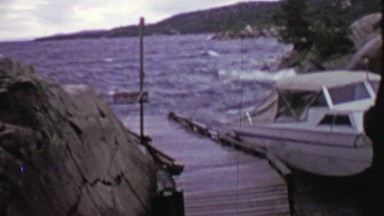 1957: Boat Tossed Around in Stormy Windy Weather Tied to Dock