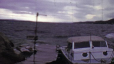 1957: Boat rocking in stormy windy weather water waves.
