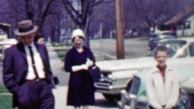 1958: Average family life people front home waiting for rides.