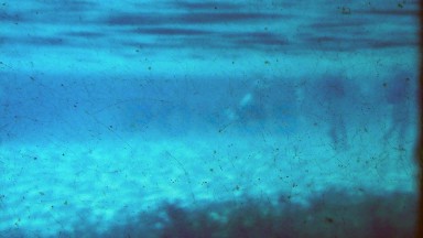 1952: Underwater Swimming Splashing in Shallow Beach Lagoon.