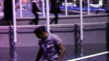 1964: Caretaker cleaning water fountain while open EXPO New York World's Fair.