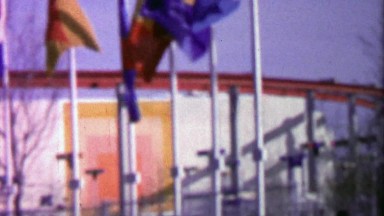 1964: International flag waving at entrance to EXPO New York World's Fair.