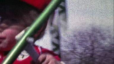 1967: Philadelphia Phillies baseball cap on kid swing set play closeup.