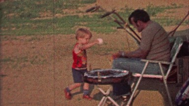1968: Boy hands dad baseball goes deep to make winning play.