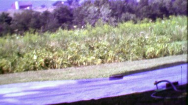1968: Homemade slip and slide boy plays on watered tarp.