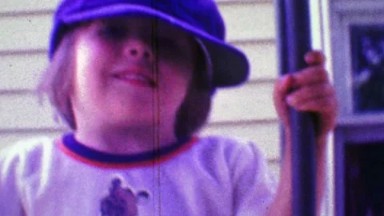 1968: Boy Wearing Dad's Hippie Cap and Cartoon Bear Shirt