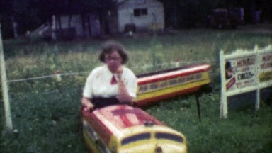1952: Duty Bound Mother Complacently Taking Kids on Mini Play Train Ride