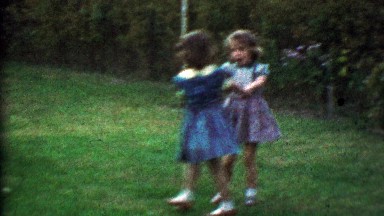 1953: Young girlfriends playing in backyard fall down tears ensue.