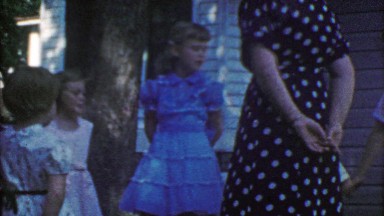 1954: Kids play duck duck goose game with parental supervision.
