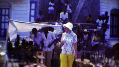 1974: Tourist women shopping native caribbean souvenir markets.
