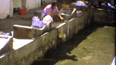 1974: Women Washing Clothes in Communal Laundry Activity with Buckets of Dirty Water