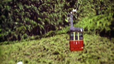 1974: Cable Car Gondola Traveling Across Dense Jungle to Scenic Lookout