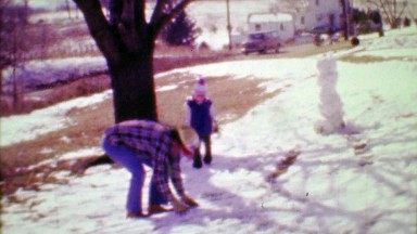 1975: Dad and Son Throw Snowballs at Each Other in Spring Snowstorm