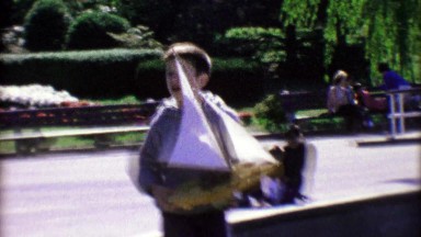 1963: Boy's Model Sailboat Toy Getting Wet on the Open Seas.