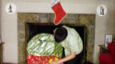 1963: Boy unwraps Basketball Goal Set Christmas holiday gift.