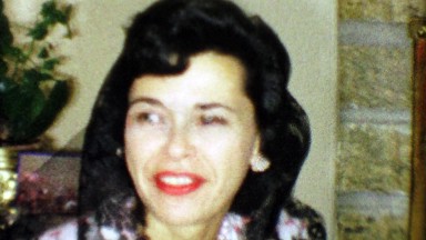 1963: Black haired woman wearing lacy veil matching her hair color.