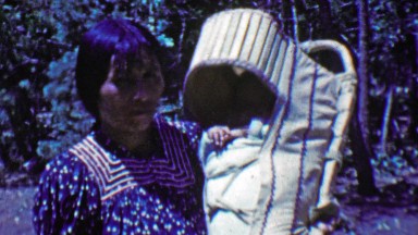 1951: Native Alaskan Inuit Woman with Baby in Papoose Sling Carrier