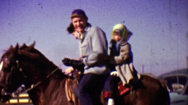 1955: Dad and Daughter Horseback Riding in Cold Alaska Weather Wave Goodbye