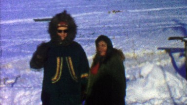1957: Native embroidered winter cold weather fur coats in snowscape.