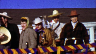 1957: High school band members sombreros Mexican theme parade.