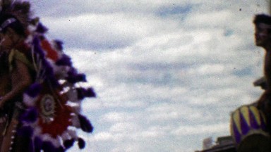 1959: Native American decorated tribal teenage boy dancers spinning.