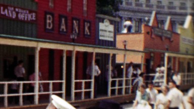 1959: Old west recreation town replica bank mainstreet crowds gather.