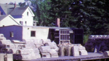 1964: Empty fishing crab traps on dock piers ready for hunting season.